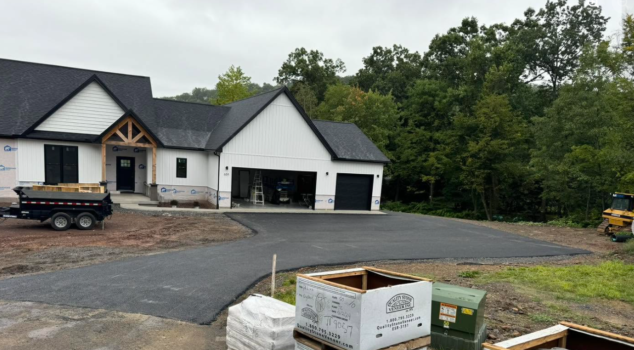 Freshly paved smooth residential driveway after