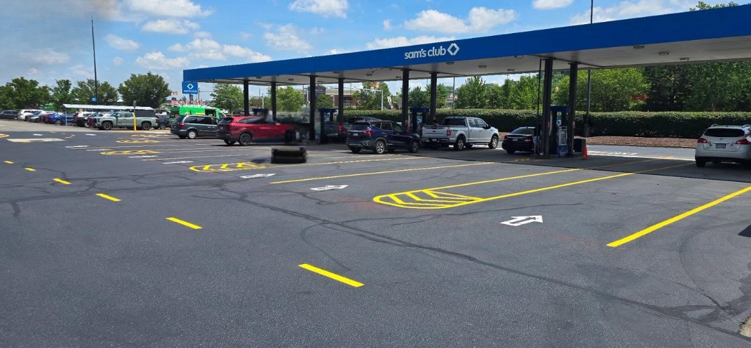 Sam's Club gas station parking lot with fresh yellow line striping