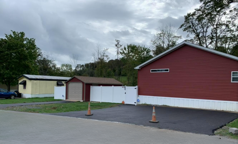 Red barn with storage sheds rural property