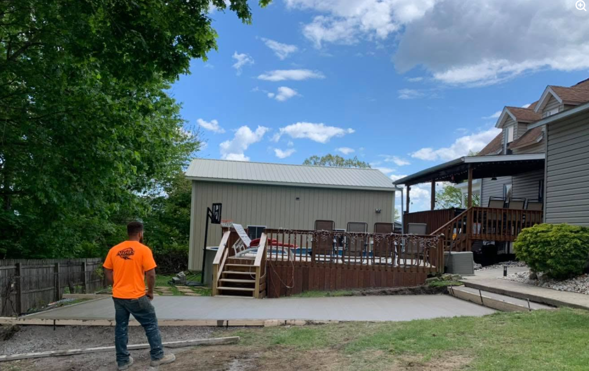 Aloners crew inspecting completed backyard patio